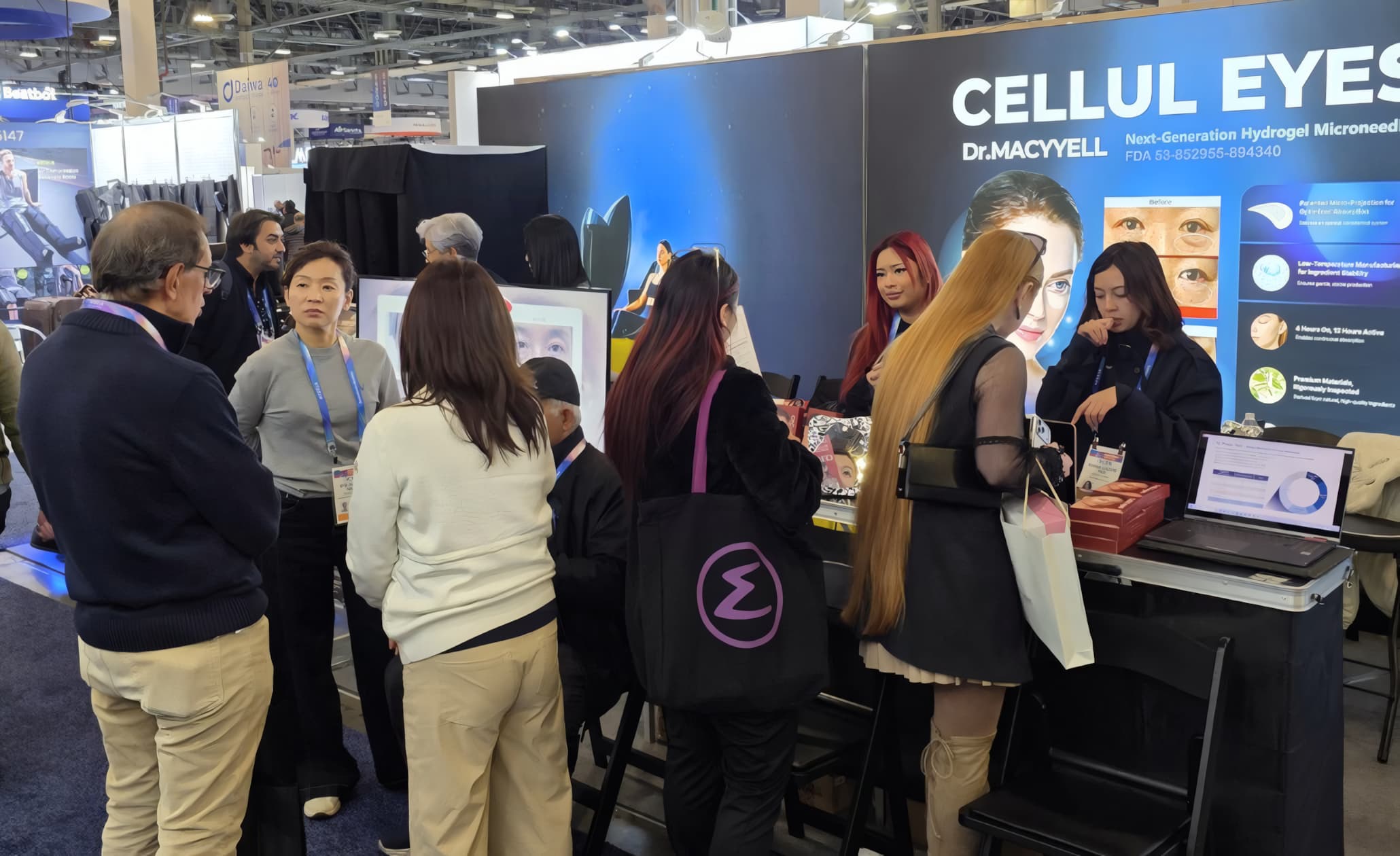 Visitors speaking with the Dr.MACYYELL team at CES