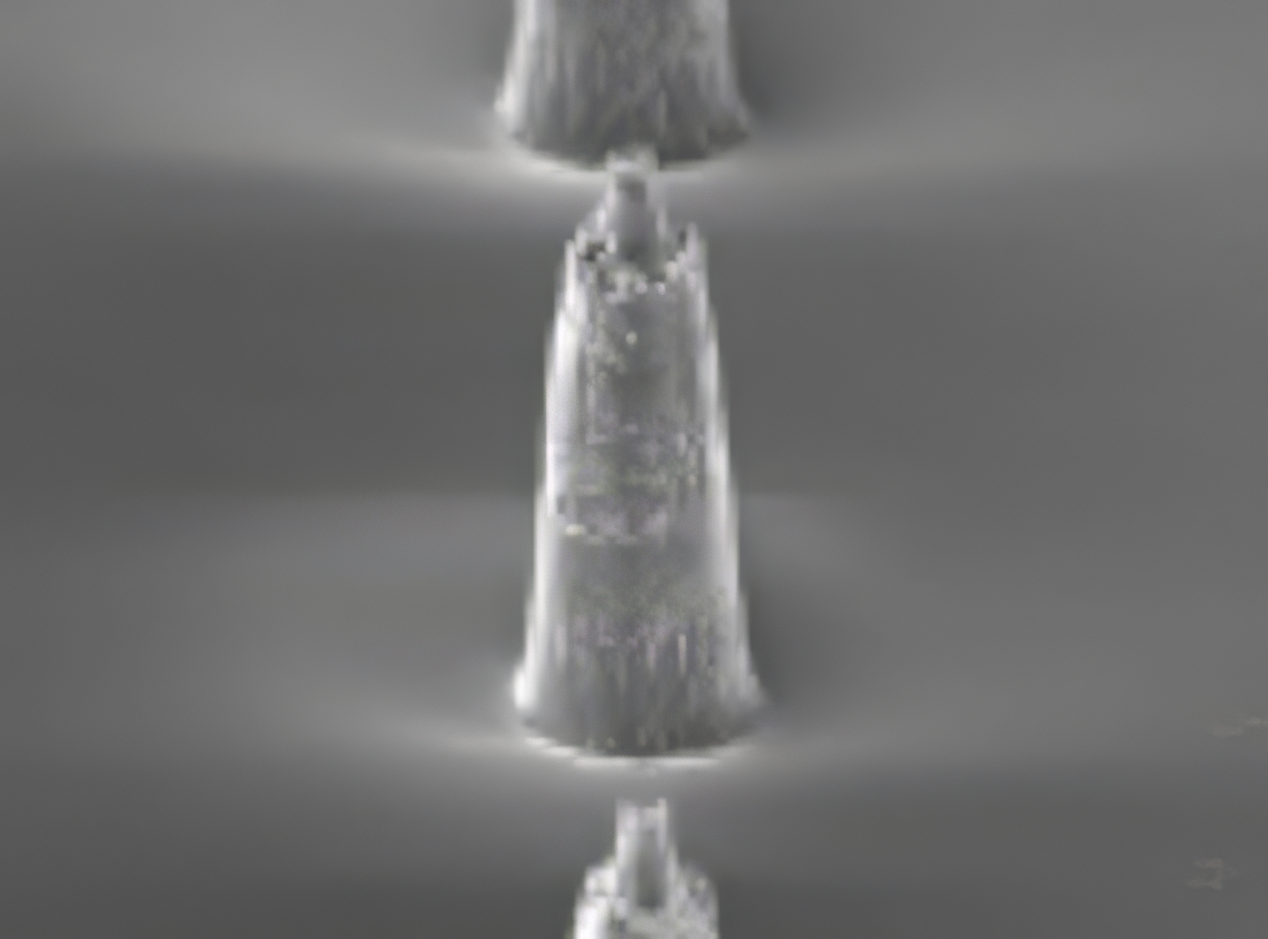 Microscope image showing the side profile of a tapered micro-needle structure